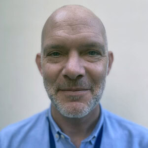Frederick Wilkinson, profile photo of man in a blue shirt